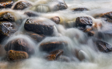 Water and rock  in the river natural motion blur abstract