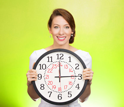 Happy time. Corporate employee holding wall clock