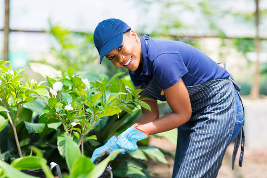 afro american woman working in nursery garden