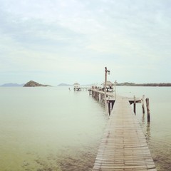 Fototapeta premium long wooden bridge to the sea
