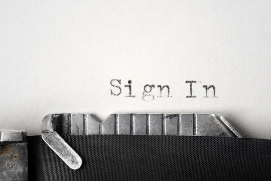 "Sign In" written on an old typewriter