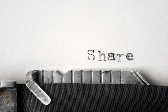 "Share" written on an old typewriter