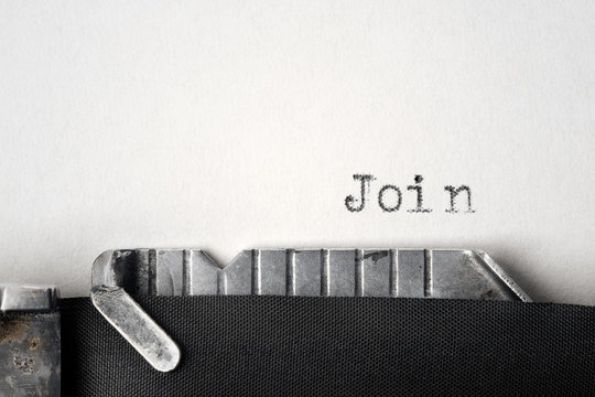 "Join" written on an old typewriter