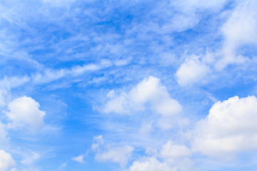 Naklejka na ściany i meble Distribution of white clouds on the clear blue sky for backgroun
