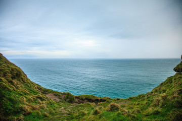  Alantic ocean and field of green grass, Ireland Europe