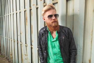 young bearded man looks up