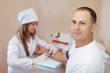 Fototapeta premium Procedure of blood capture from vein