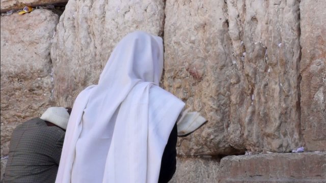 Jewish man pray at the western wall