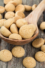 Traditional italian almond cookies - amaretti, on wooden surface