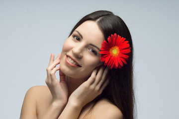 Fototapeta na wymiar Caucasian brunet girl with flower