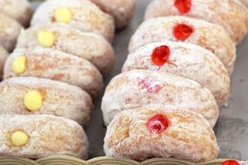 A lot of donut and strawberry jam