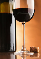 A bottle of wine and two glasses.