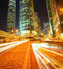 Fototapeta premium Road tunnels light trails on modern city buildings backgrounds i