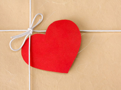Red heart on a gift box.