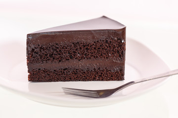 Chocolate cake on white dish