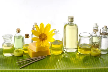 Wandcirkels tuinposter Health spa with massage oil and sunflower ,soap on leaf © Mee Ting