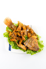 Thai food fried fish in white plate isolated on white background