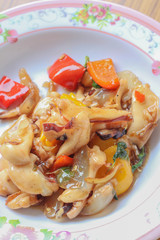 Fried squid with peppers, basil.