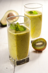 Green smoothie with avocado, kiwi, cucumber and mint
