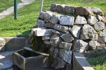Fountain made of stone in nature