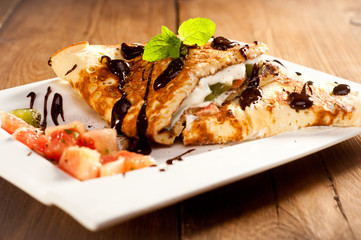 Sponge Pancakes with cheese, fruit, chocolate and mint