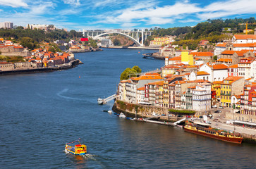Fototapeta na wymiar Portugal, Porto, the boat floats down the river Duoro