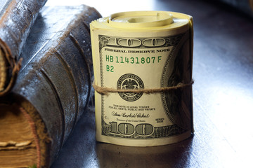 Rolled $100 dollar bills