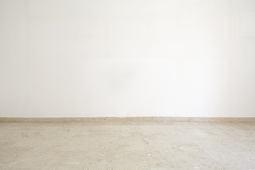 Empty room with marble floor and white wall