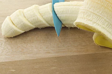 Fototapeten Geschnittene Banane © Coramija