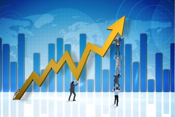 Composite image of business team holding up arrow