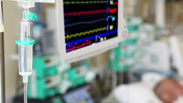 IV drip with monitor and patient in ICU