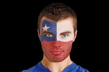Composite image of serious young chile fan with facepaint