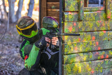 shooter behind fortification with paint splashes