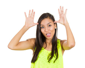 Young woman making funny face, sticking out her tongue