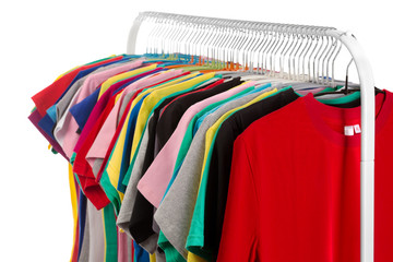 Obraz premium Colored shirts on hangers steel.