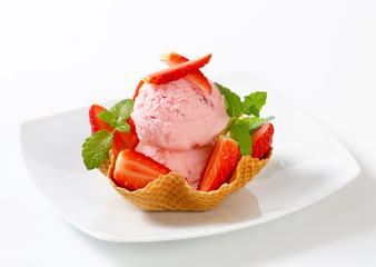 Strawberry ice cream in waffle basket