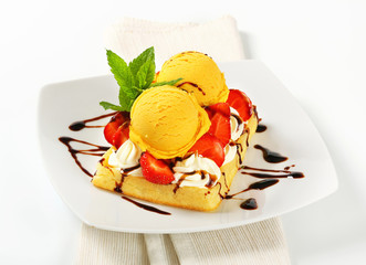 Waffle with ice cream and strawberries
