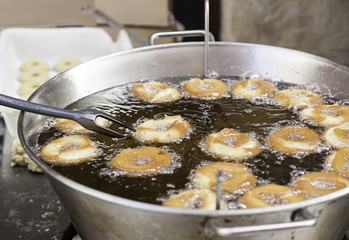 Frying donuts in the street