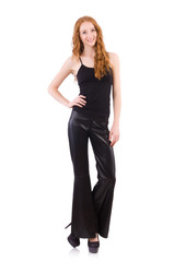 Fototapeta premium Redhead woman in black bell bottom pants on white