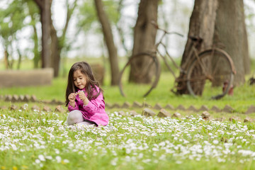 Little girl at the spring field
