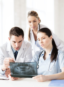 group of doctors looking at x-ray