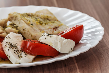 roasted fish and Italian caprese salad