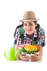 Girl watering plants on white