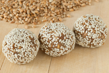balls from ground wheat sprouts with sesame seeds