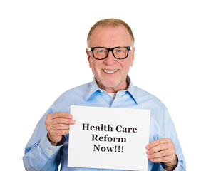 happy senior elderly man with health care reform sign