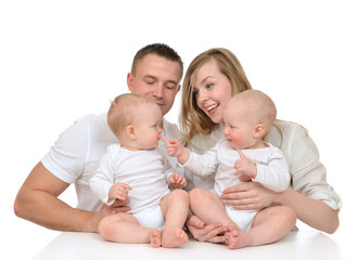 family mother and father with newborn child baby kids