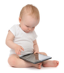 Infant child baby toddler sitting and typing digital tablet mobi