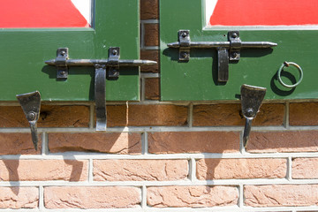 Close-up shot of a latches on a wooden Dutch doors