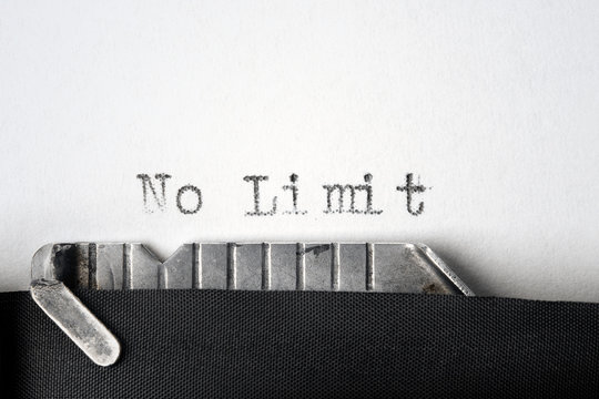 "No Limit" written on an old typewriter. Closeup.