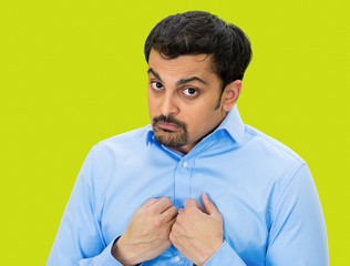 Portrait Shy young man isolated on green background 